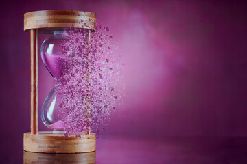 Dissolving hourglass on vintage background