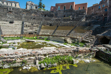 Obraz premium Ruins of the ancient Greek Roman theatre in the historic centre of Catania, Sicily , Italy