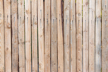 Wooden fence of waste boards