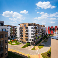 Multi-family building, aerial view. Viaw of block of flats in suburban area under the blue sky with idyllic clouds. - 415114503