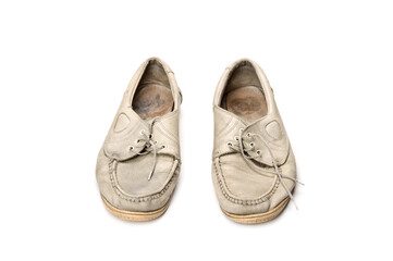 Old walking shoes on white background