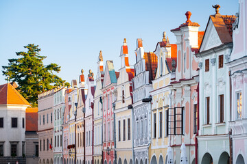 Row of traditional houses in the town of Telč, Czech Republic, after the sunrise. These houses on the main square are UNESCO heritage site.