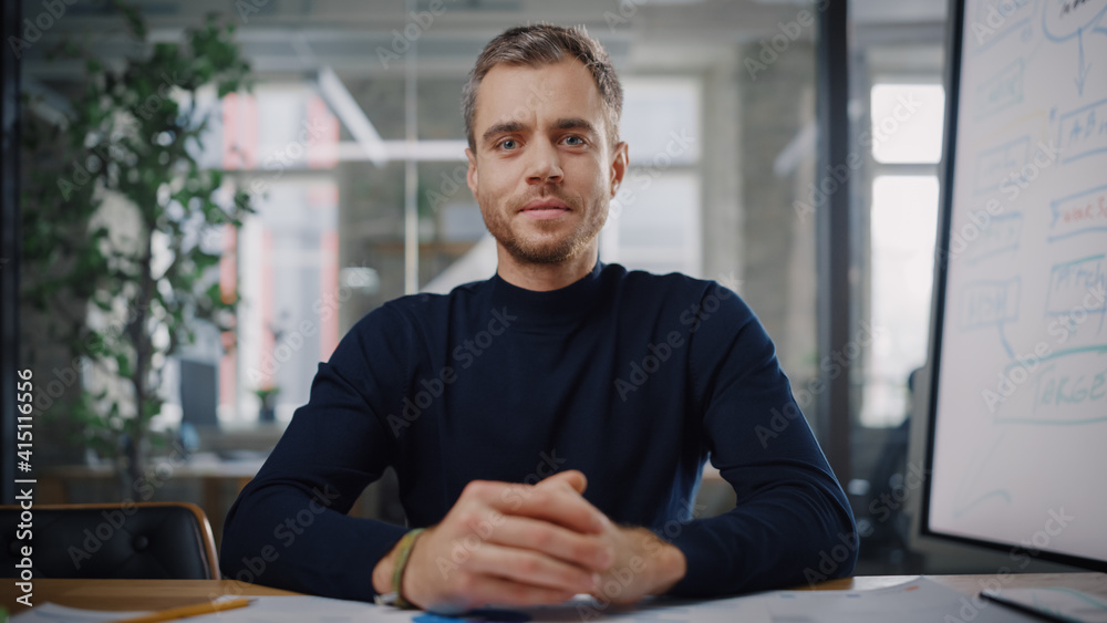 Poster Point of View from Camera with Handsome Young Project Manager Making a Video Call in Creative Office Environment. Happy Caucasian Male Specialist Talking to Colleague Over a Live Camera.