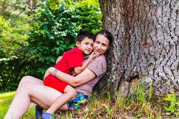 Fototapeta premium mother and son having fun in nature
