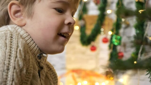 Cute Little Child Boy Watching at Decorated Christmas Tree. x2 Slow motion 60fps 4K