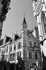 Beautiful medieval building with tower. Sunny day in the Old Town of Riga, Latvia. Vertical view, black and white photo