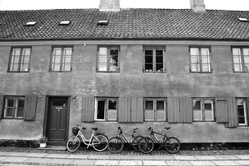Old medieval district in Copenhagen, Denmark. Orange facade of the house of Nyboder district with...