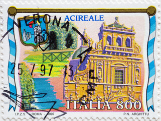 ITALY- CIRCA 1997: a postage stamp printed in the Italy showing the baroque church of San Sebastiano in Acireale Sicily, Italy