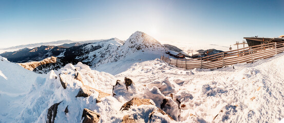 Chopok in Low Tatras national park with mountain hut and Jasna ski resort cableway station in winter. Liptov region. Demenovska walley.