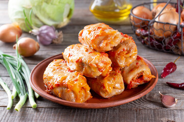 Delicious homemade stuffed cabbage leaves (the traditional dolma of the mediterranean cuisine) in a ceramic bowl