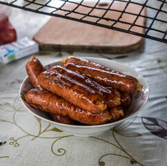 Fried sausage. B-B-Q. Grid for cooking over an open fire.