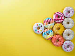 Set of donuts on yellow background.
