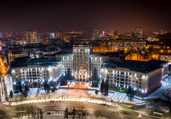 Fototapeta na wymiar Aerial night winter view to Karazin National University at Svobody square in Kharkiv, Ukraine