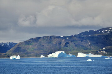 Greenland. Icebergs in the ocean. The nature of the North.