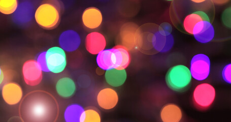 Fototapeta premium Colored bokeh abstract background. Decoration at Christmas holiday.