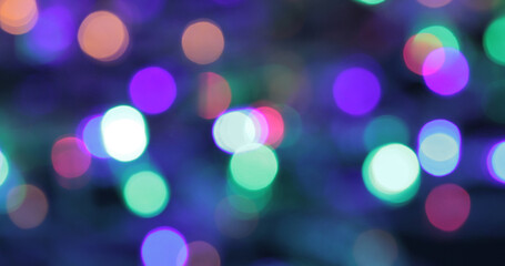 Obraz premium Colored bokeh abstract background. Decoration at Christmas holiday.