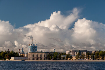 Fototapeta premium Cumulus clouds above Smolny cathedral, Saint Petersburg