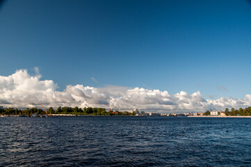 Cumulus clouds and blue sky above the Neva river, Saint Petersburg