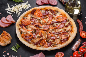 Fresh delicious pizza made in a hearth oven with sausage, pepper and tomatoes