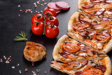 Fresh delicious pizza made in a hearth oven with sausage, pepper and tomatoes