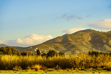 Spanish coast landscape with church on hill