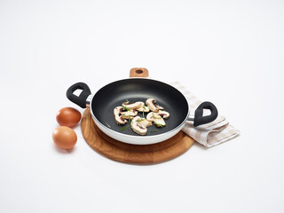 Isolated frying pan and ingredients
