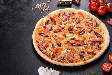 Fresh delicious pizza made in a hearth oven with tomatoes, sausage and mushrooms