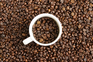 Mug with fragrant coffee beans