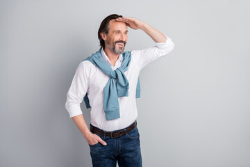 Photo of attentive funny mature guy dressed white shirt pullover shoulders looking far away arm...