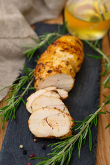 Homemade spiced chicken pastrami baked in oven with rosemary