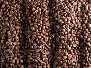 Macro photo of roasted arabica coffee beans.