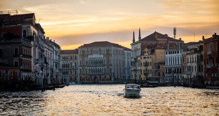 Panoramic of Venice Canal Grande at sunset with boat sailing