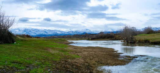Snowy Talysh mountains, greens and Lankaran river in Azerbaijan