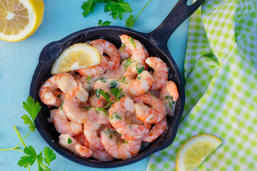Creamy garlic prawns in coconut sauce with parsley
