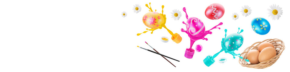 Multicolored easter painted eggs, paints and brushes. Festive Easter banner from eggs, paints and brushes in air on white background with copy space for text.