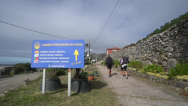 A video of Two Pilgrims Hikers walk hike the way of Saint James Camino de Santiago. Follow the sign and Shell in Covid times.
