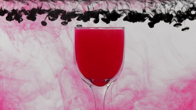 A glass and paints in the water