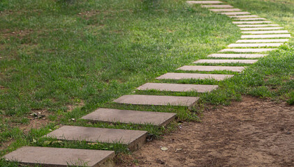 front view stone walk floor standing on grassy floor in park