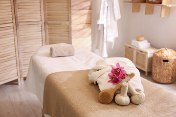 Beautiful spa accessories in stylish massage room