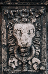 Fragment of the Boim chapel in Lviv, Ukraine. Old Renaissance architecture, reliefs and sculptures of lion, decorative details and elements close-up.