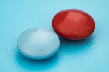 Multicolored tablets on blue background. Health care concept.