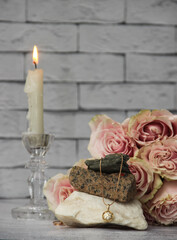 still life with candle and roses