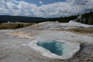 Colorful geothermal features at Old Faithful geothermal area in Yellowstone National Park, Wyoming, USA