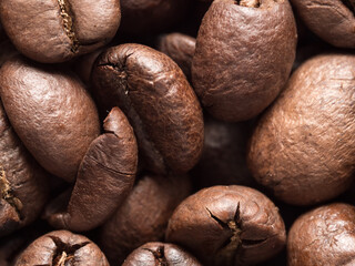 Macro photo of roasted arabica coffee beans.