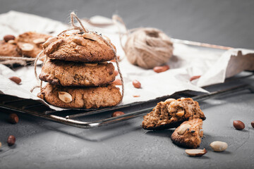 Homemade peanut cookies on a wire rack. Grey background. Country style.