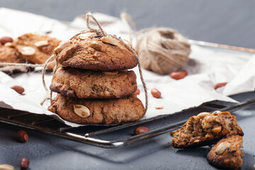 Homemade peanut cookies on a wire rack. Grey background. Country style.