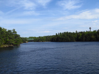the view of a tower and a bridge on the Thousand Islands boat tour, Ontario, Canada, May