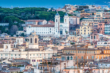 Trinita dei Monti church in Rome, obelisk and rooftops