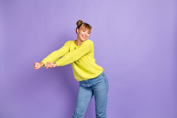 Portrait of pretty cheerful girl dancing having fun wearing cozy clothes isolated over pastel violet color background