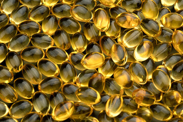 Bunch of fish oil capsules as background.